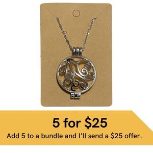 Essential oil diffuser locket on silver chain.